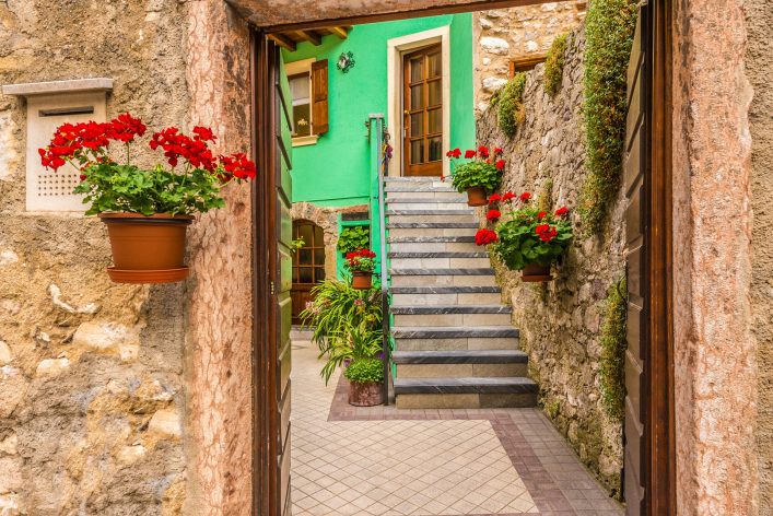 entrance-of-an-old-apartment-building-in-malcesine-italy-shutterstock_292822877-2