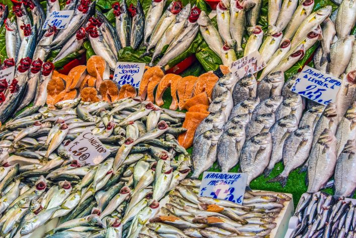 grazing-horses-and-a-farm-seen-in-iceland-shutterstock_363587903-2