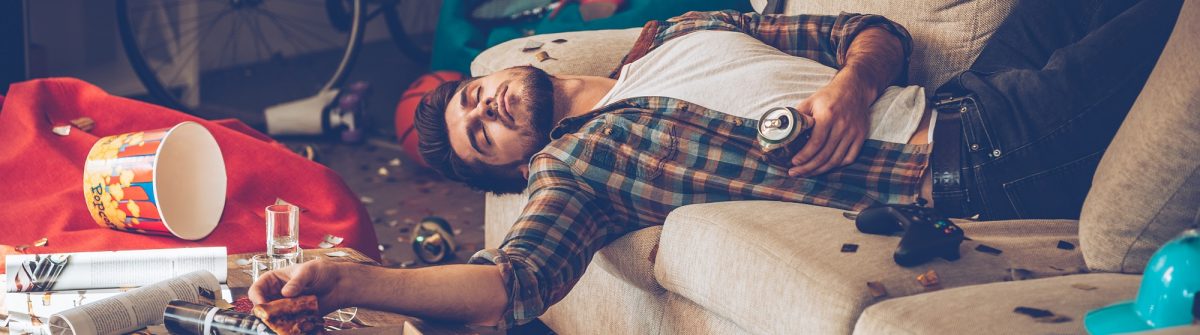 hangover_man-lying-on-the-couch_shutterstock_393544207