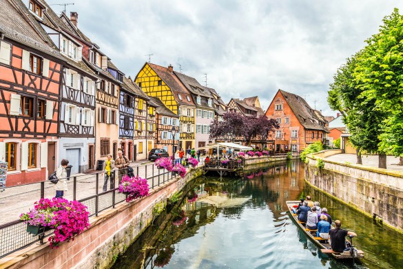 Colmar, France - July 3, 2013: people visit town of Colmar, France. Colmar has thousands of small canals and therefore people call it little Venice.