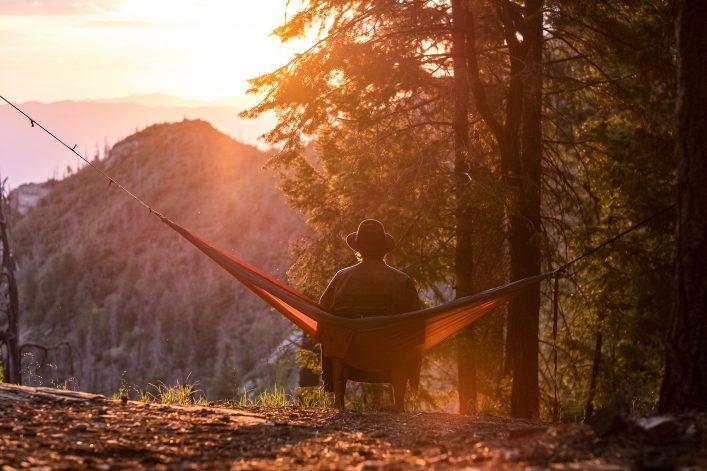 Man in hammock sunset or sunrise