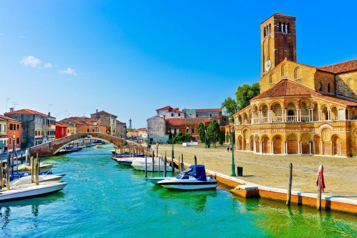 View-of-the-colorful-Venetian-houses-along-the-canal-at-the-Islands-of-Murano-in-Venice.-shutterstock_715466410