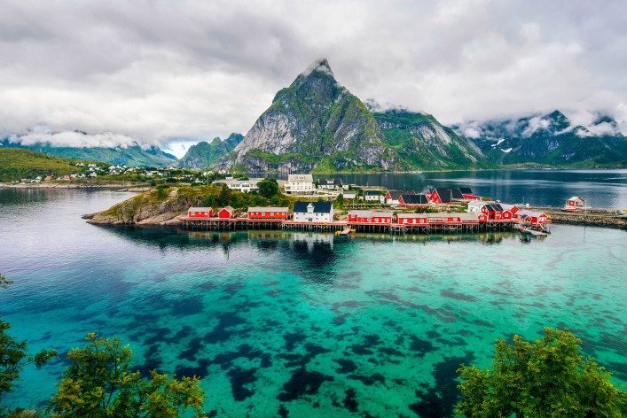 Scenic fjord on Lofoten islands with fishing hut and mountains