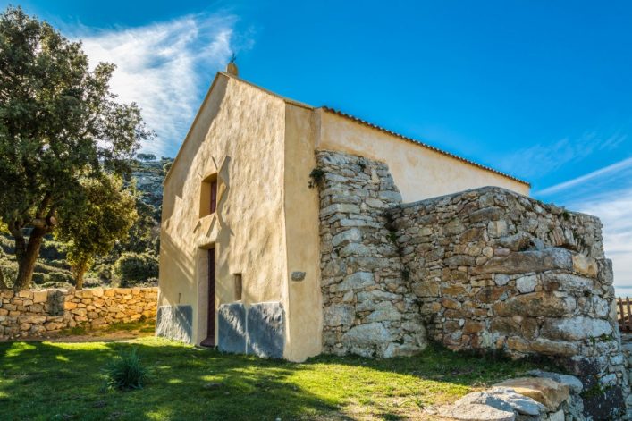 notre-dame-de-la-stella-chapel-with-olive-tree-near-lumio-in-balagne-region-of-corsica-shutterstock_249692521-2