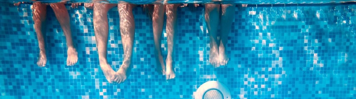 childrens-adults-legs-underwater-swimming-pool_shutterstock_244172107
