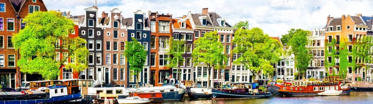 amsterdam-with-canal-in-the-downtown-holland-istock_000030442394-1