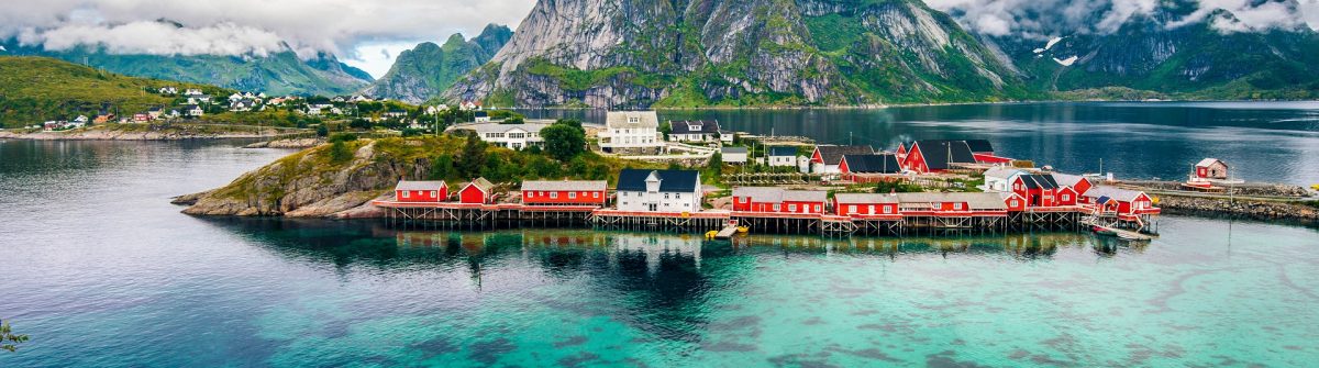 Scenic fjord on Lofoten islands with fishing hut and mountains