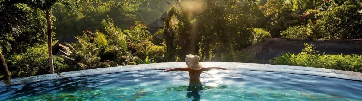 Bali-Infinity-PoolWoman-sunbathing-in-infinity-swimming-pool-at-luxurious-resort-shutterstock_489675709