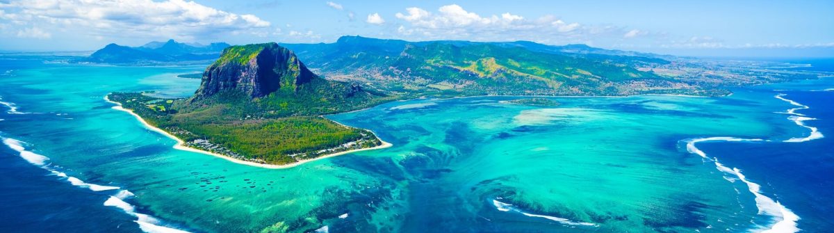 Aerial-view-of-Mauritius-island-panorama-and-famous-Le-Morne-Brabant-mountain-beautiful-blue-lagoon-and-underwater-waterfall-shutterstock_733185379