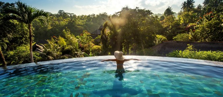 Bali-Infinity-PoolWoman-sunbathing-in-infinity-swimming-pool-at-luxurious-resort-shutterstock_489675709-smaller-1